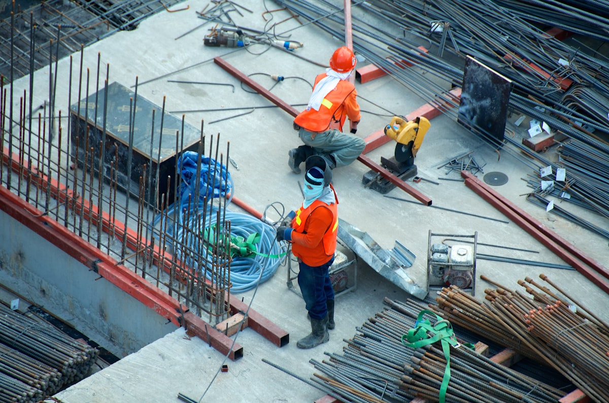 Prefabricated steel warehouse construction site with foundation work